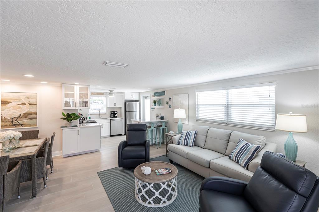 6154 Midnight Pass Road, Unit D15 Sarasota, FL 34242 - Photo 4 of 23 a living room with furniture and a large window