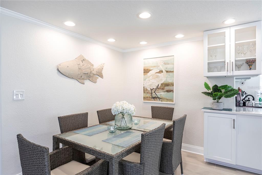 6154 Midnight Pass Road, Unit D15 Sarasota, FL 34242 - Photo 7 of 23 a view of a dining room with furniture