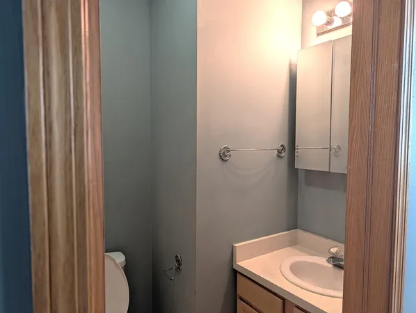 a bathroom with a sink and mirror