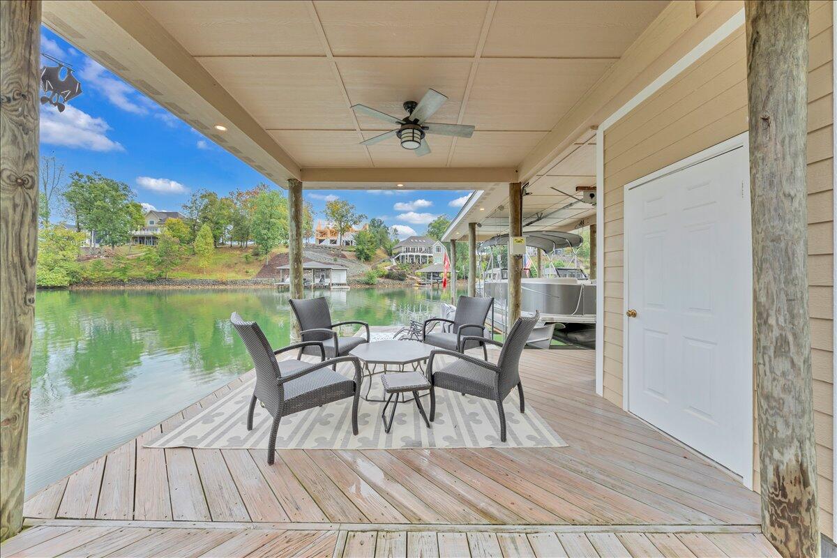 6 Compass Moneta, VA 24121 - Photo 44 of 60 a view of a patio with dining table and chairs