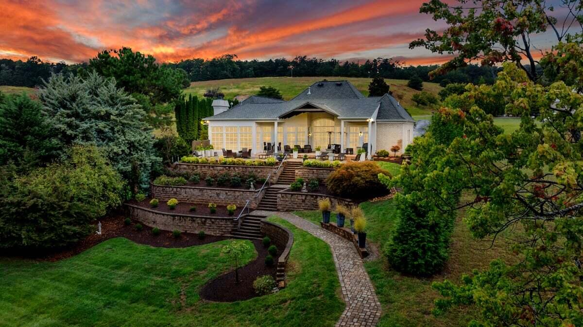 6 Compass Moneta, VA 24121 - Photo 56 of 60 a view of a big house with a big yard plants and large trees