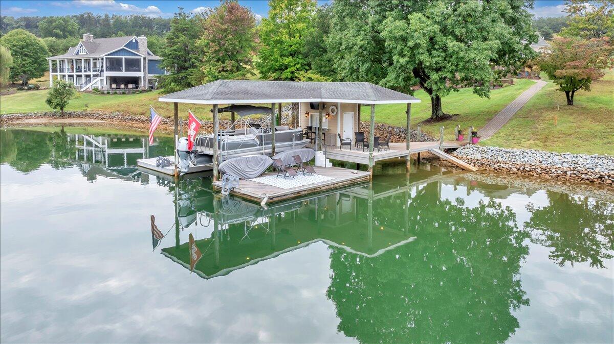 6 Compass Moneta, VA 24121 - Photo 6 of 60 a view of a patio with chairs and a yard
