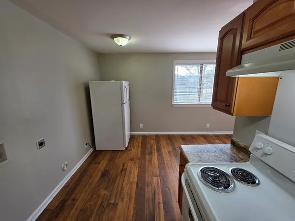 a view of front door with wooden floor