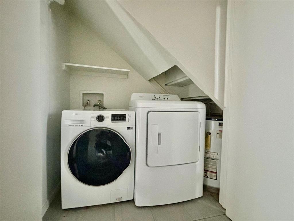 7700 Chapin Road, Unit 7 Fort Worth, TX 76116 - Photo 11 of 13 Dedicated laundry area featuring a shelf and utility connections