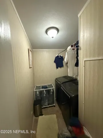 a kitchen with a refrigerator and stove