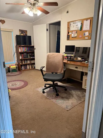 a workspace with furniture and window