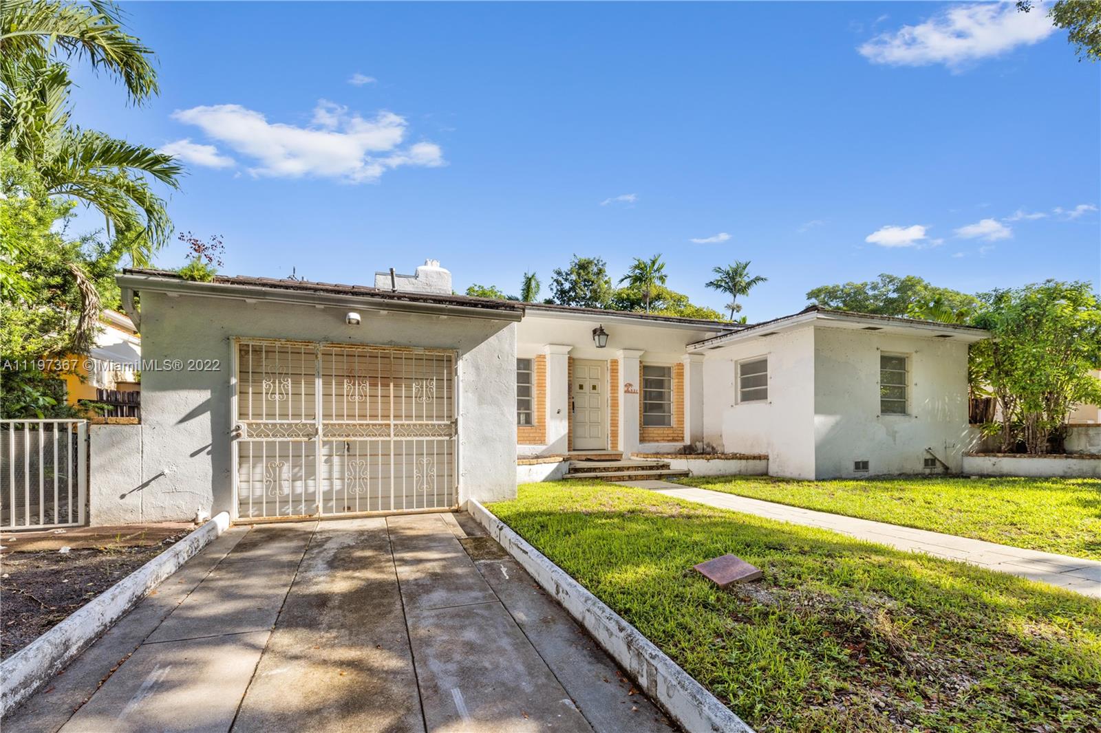 531 Northeast 55th Terrace Miami, FL 33137 - Photo 3 of 22 front view of a house with a yard
