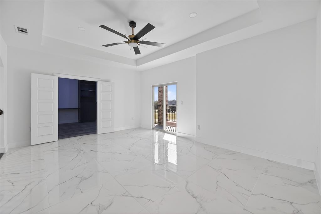 1530 South Houston School Road Lancaster, TX 75146 - Photo 29 of 37 a view of an empty room with a ceiling fan