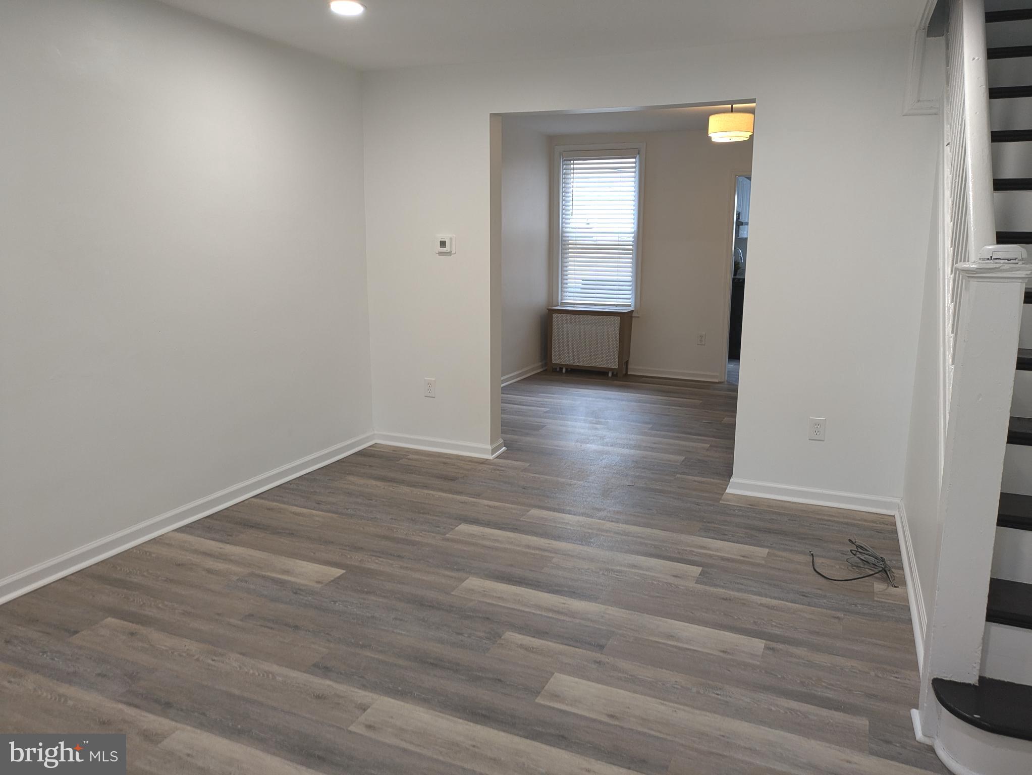 417 Copley Road Upper Darby, PA 19082 - Photo 6 of 23 a view of wooden floor and windows in a room