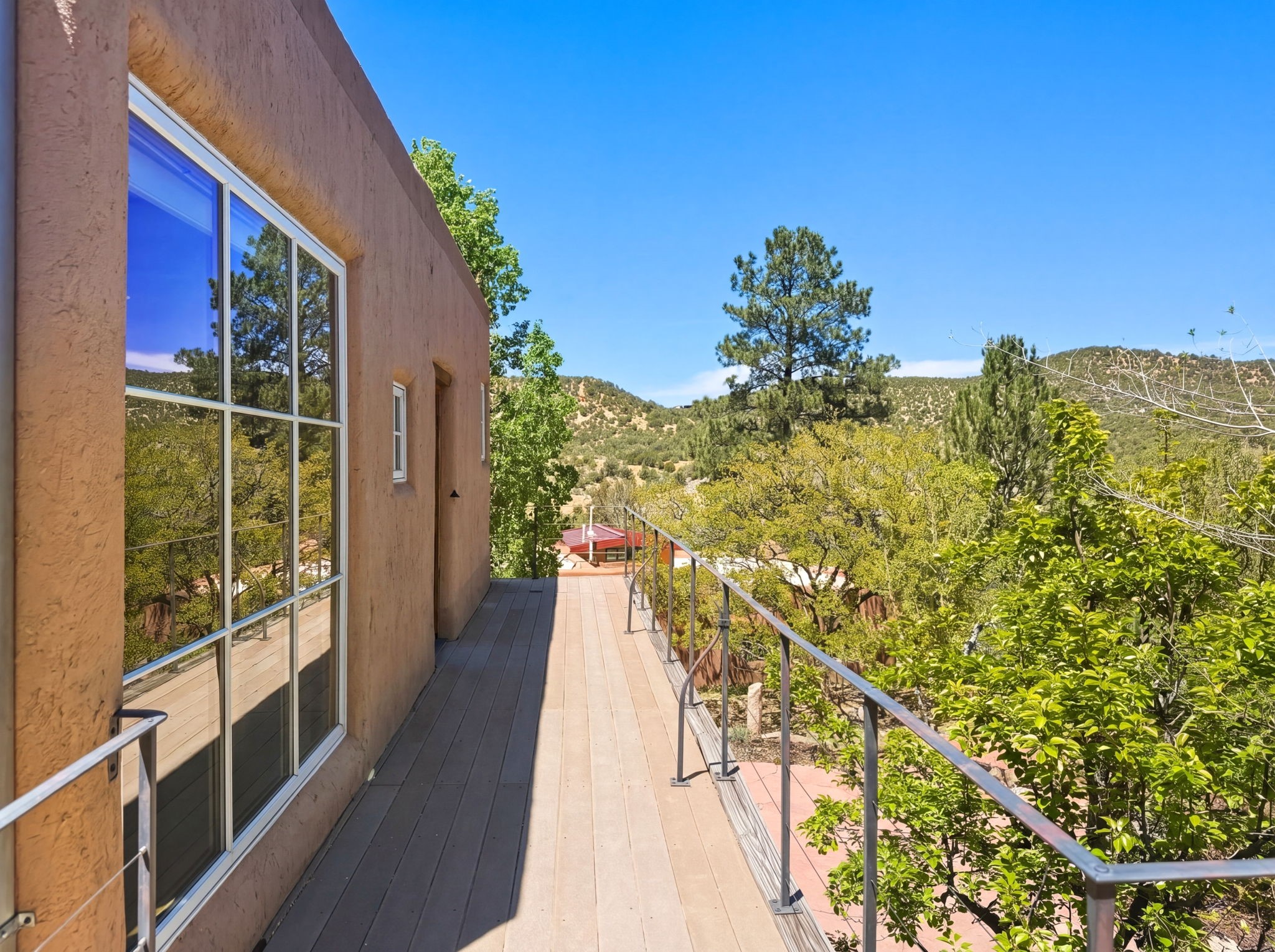 1692 Upper Canyon Road Santa Fe, NM 87501 - Photo 34 of 52 Expansive Balcony with seating, capturing panoramic views and leading to the private retreat.