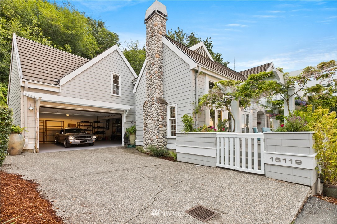 16119 73rd Place West Edmonds, WA 98026 - Photo 11 of 40 a view of a house with a yard and parking space