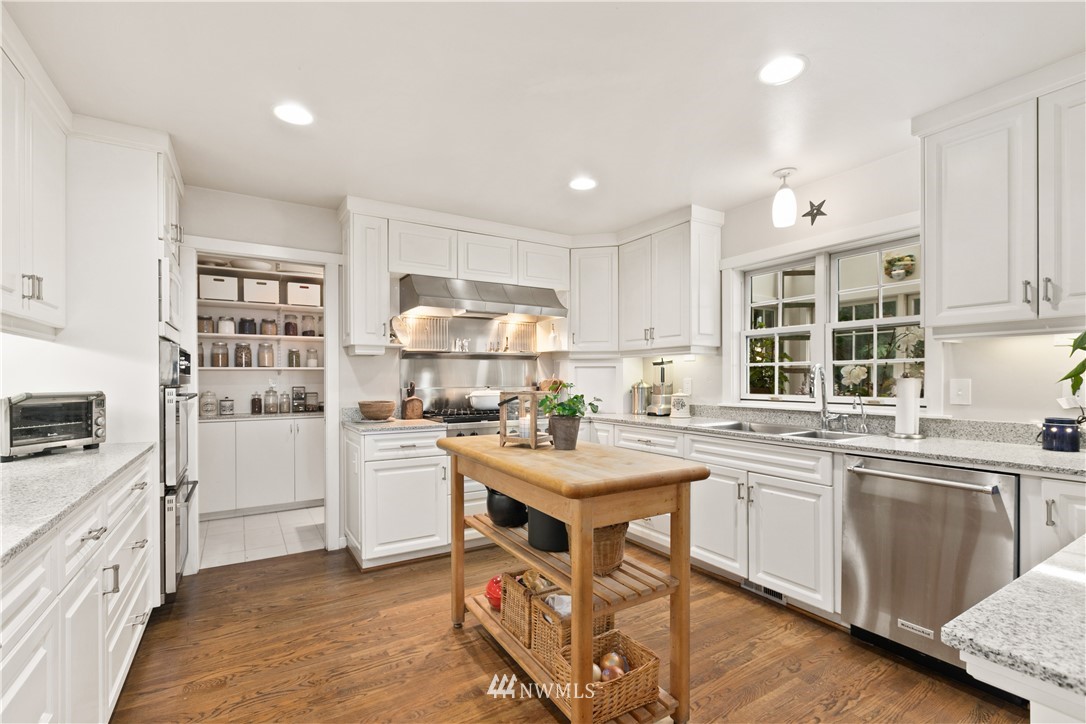 16119 73rd Place West Edmonds, WA 98026 - Photo 17 of 40 a kitchen with a sink stove and cabinets