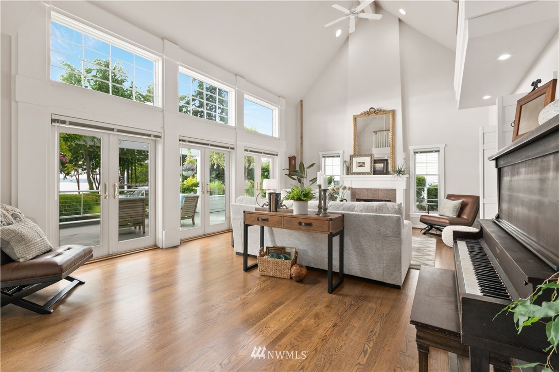16119 73rd Place West Edmonds, WA 98026 - Photo 20 of 40 a living room with furniture floor to ceiling window and wooden floor