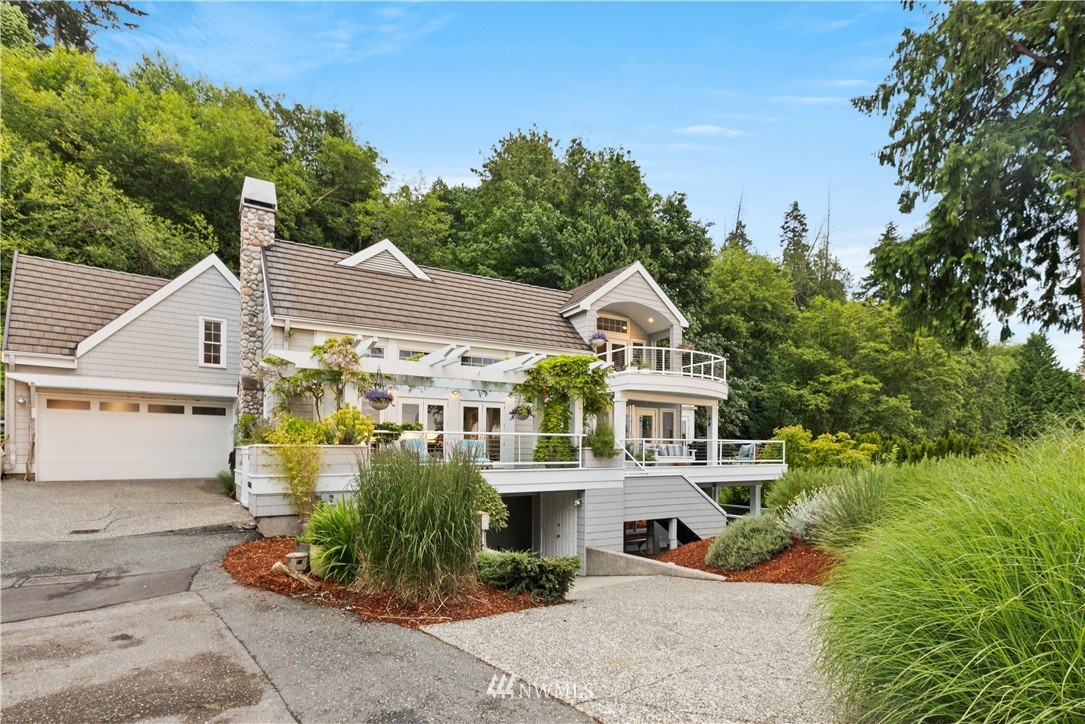 16119 73rd Place West Edmonds, WA 98026 - Photo 3 of 40 a front view of a house with a garden
