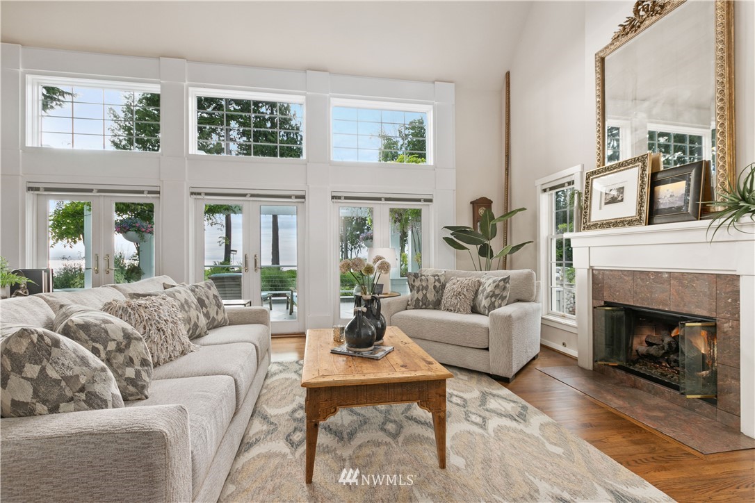 16119 73rd Place West Edmonds, WA 98026 - Photo 23 of 40 a living room with furniture a fireplace and a large window