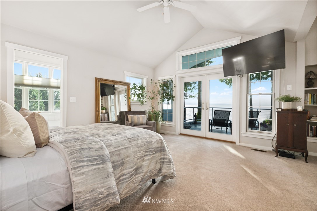 16119 73rd Place West Edmonds, WA 98026 - Photo 26 of 40 a spacious bedroom with a large bed and a large window