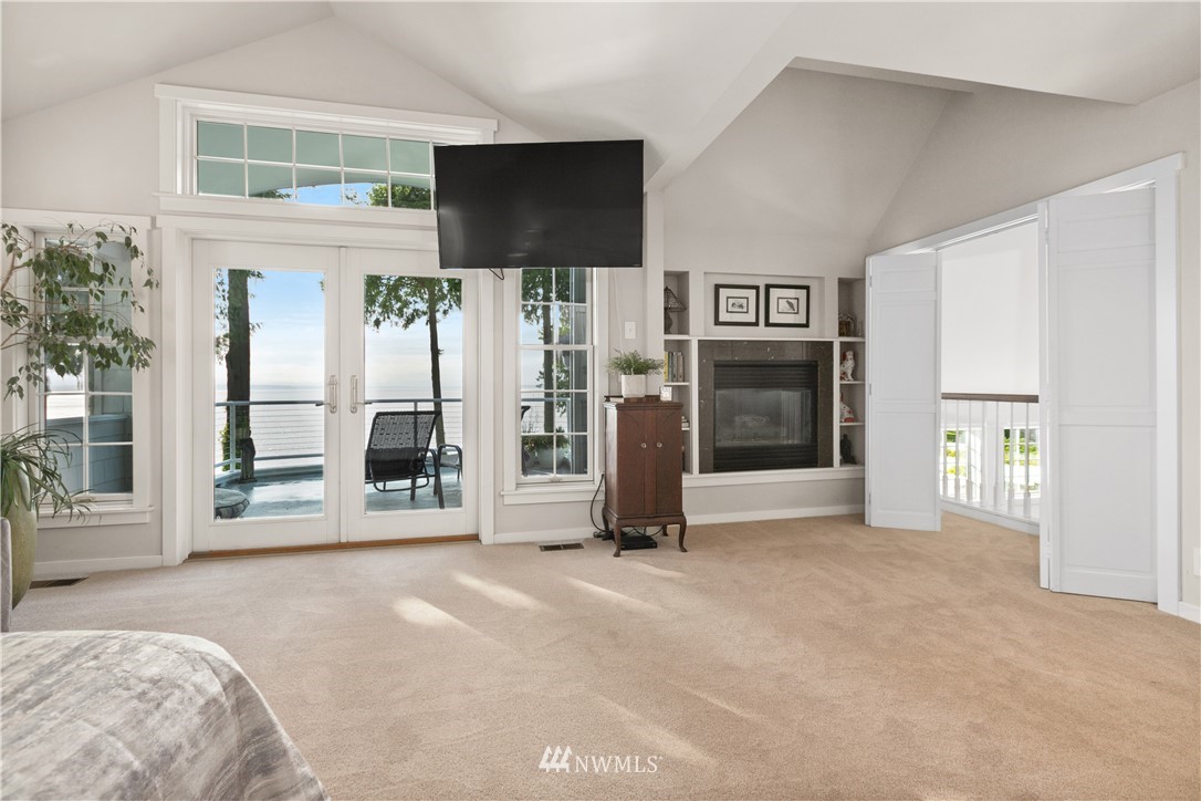 16119 73rd Place West Edmonds, WA 98026 - Photo 27 of 40 a view of an empty room with a fireplace and a window