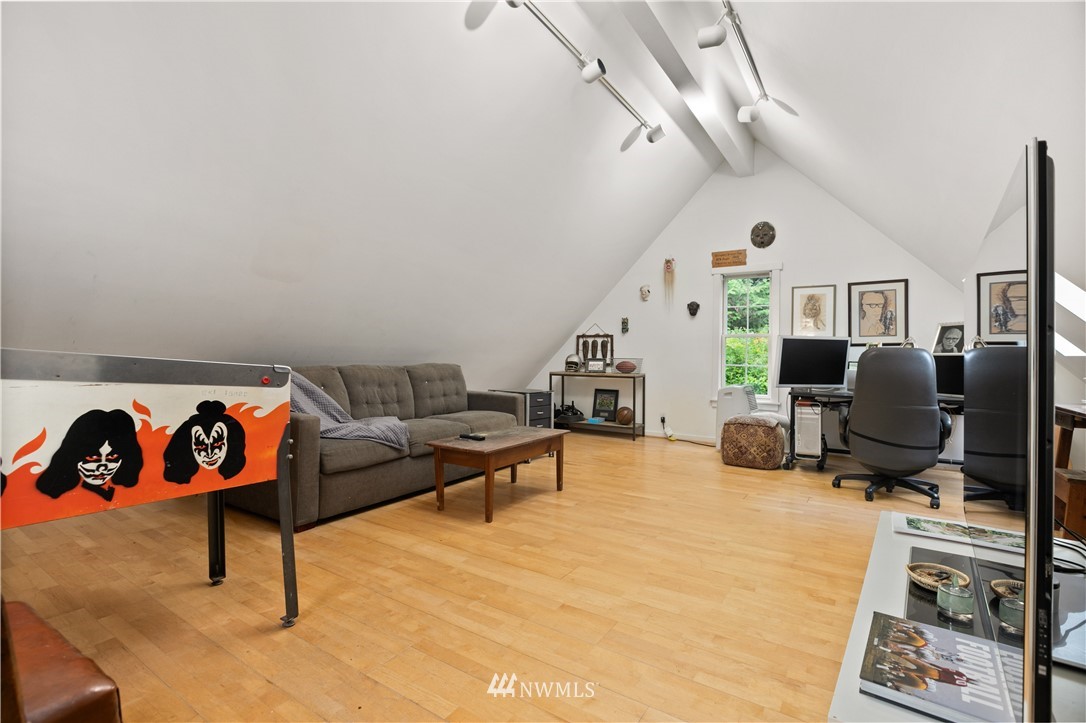 16119 73rd Place West Edmonds, WA 98026 - Photo 32 of 40 a living room with furniture a flat screen tv and a window