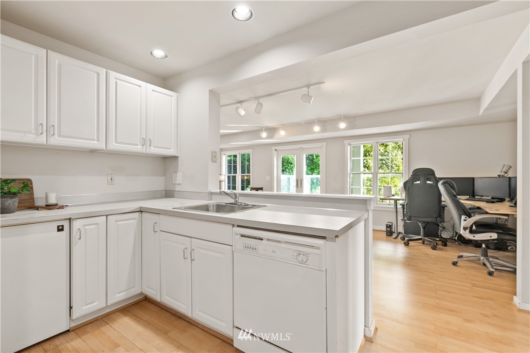 16119 73rd Place West Edmonds, WA 98026 - Photo 35 of 40 a kitchen with white cabinets and sink