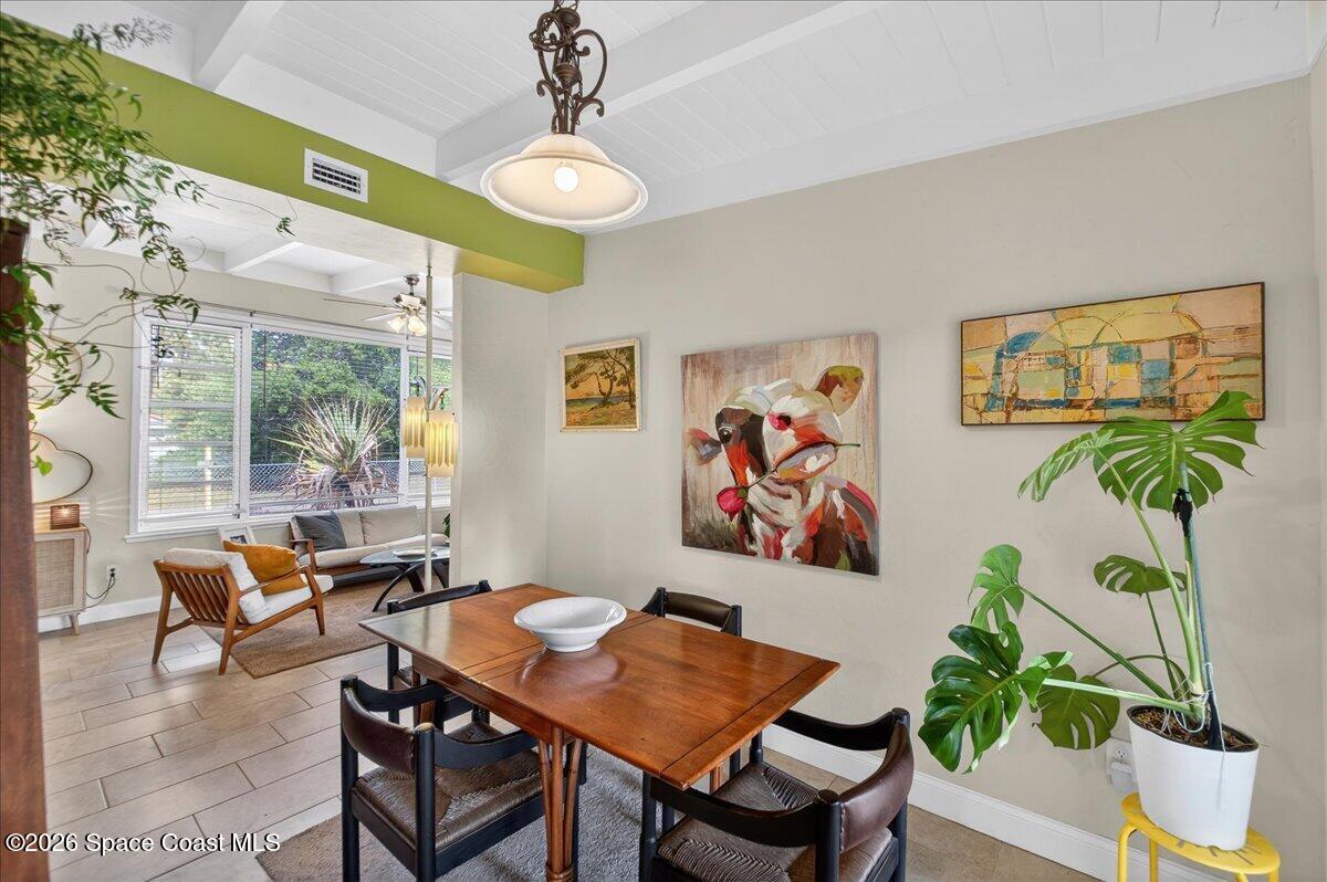 1615 Grandview Way Melbourne, FL 32935 - Photo 13 of 34 a workspace room with furniture and a potted plant