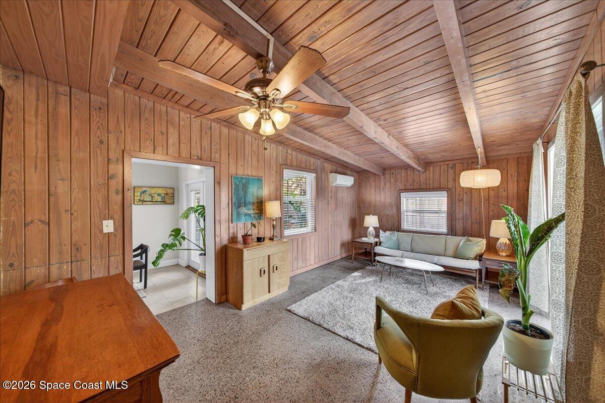 1615 Grandview Way Melbourne, FL 32935 - Photo 15 of 34 a living room with furniture and a chandelier