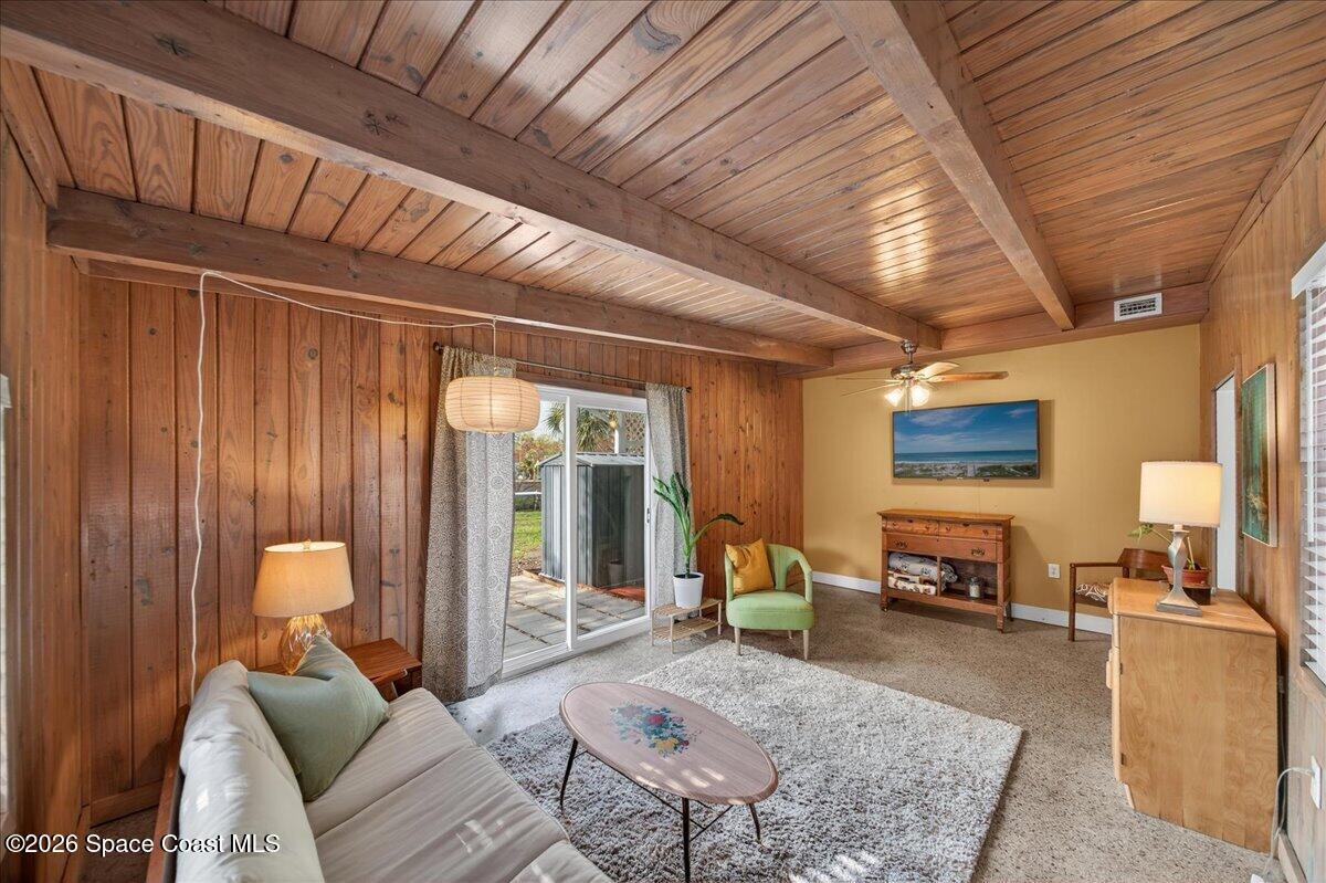 1615 Grandview Way Melbourne, FL 32935 - Photo 16 of 34 a living room with furniture and a table
