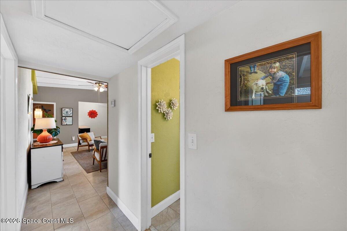 1615 Grandview Way Melbourne, FL 32935 - Photo 19 of 34 a view of a hallway with workspace and livingroom view