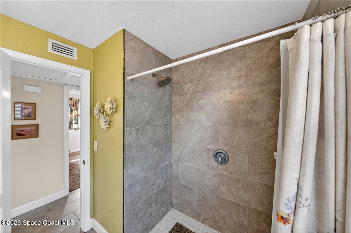 1615 Grandview Way Melbourne, FL 32935 - Photo 20 of 34 a bathroom with a shower and a sink