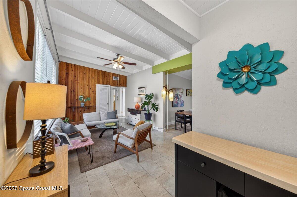 1615 Grandview Way Melbourne, FL 32935 - Photo 2 of 34 a living room with furniture a rug and a potted plant