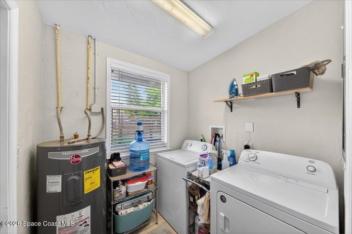1615 Grandview Way Melbourne, FL 32935 - Photo 24 of 34 a utility room with dryer and washer
