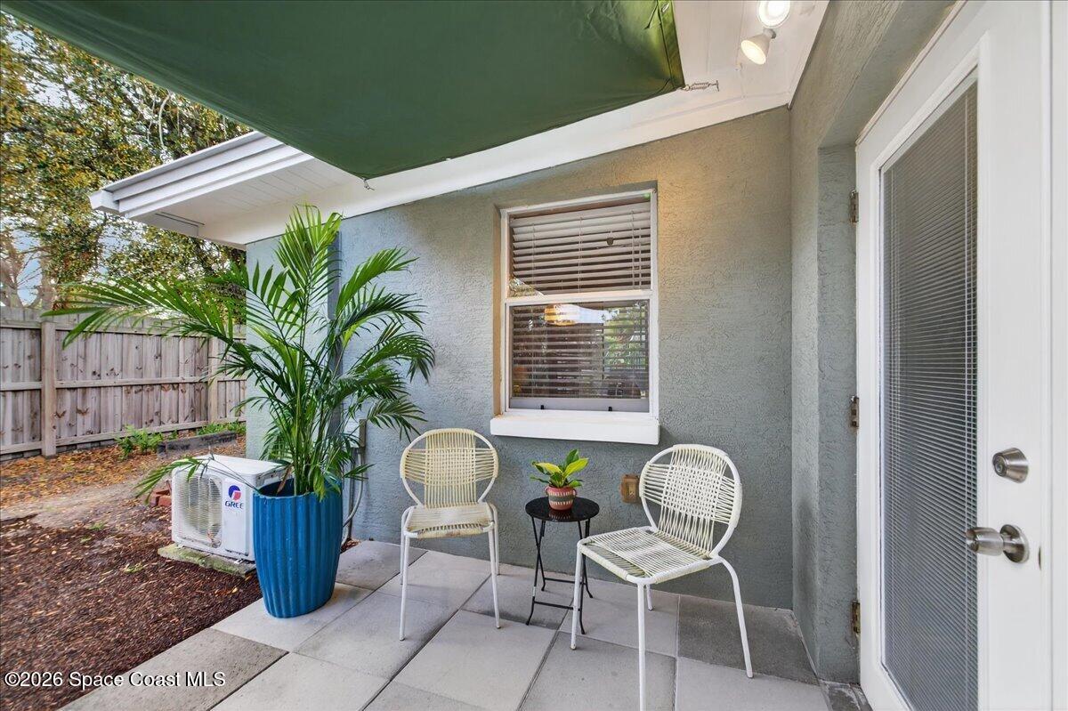 1615 Grandview Way Melbourne, FL 32935 - Photo 25 of 34 a front view of a house with garden and seating area