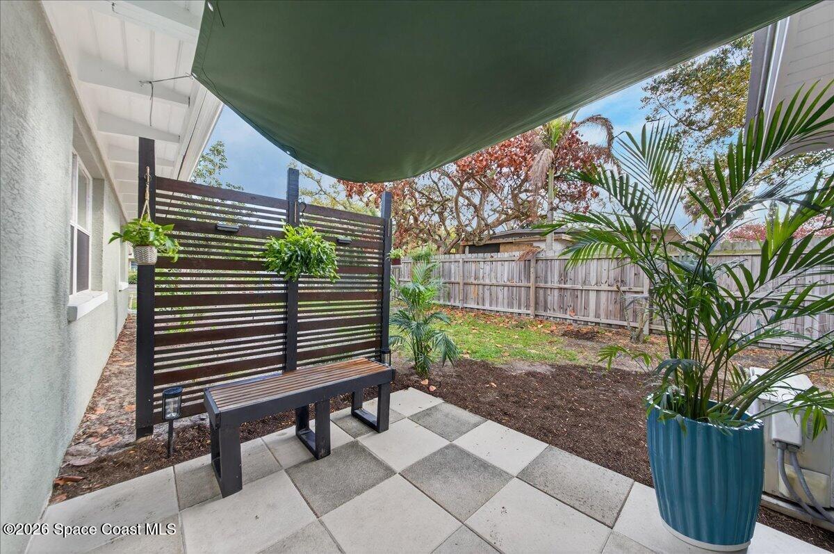 1615 Grandview Way Melbourne, FL 32935 - Photo 26 of 34 a view of a backyard with a bench