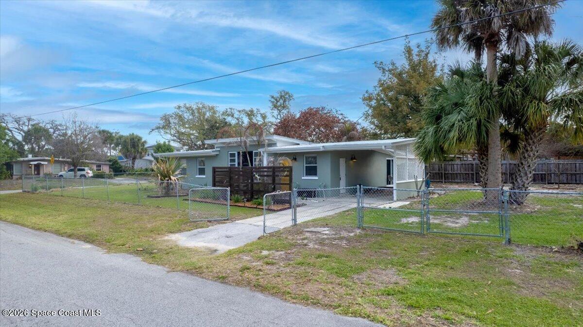 1615 Grandview Way Melbourne, FL 32935 - Photo 29 of 34 a view of a house with backyard porch and sitting area