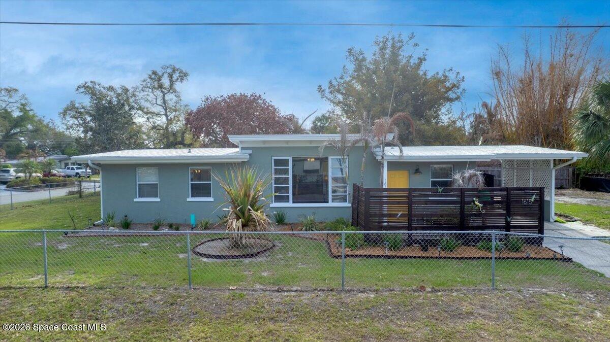 1615 Grandview Way Melbourne, FL 32935 - Photo 34 of 34 a front view of a house with garden