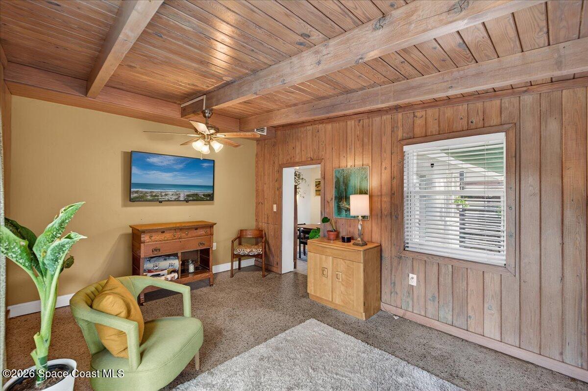 1615 Grandview Way Melbourne, FL 32935 - Photo 5 of 34 a living room with furniture a flat screen tv and a window