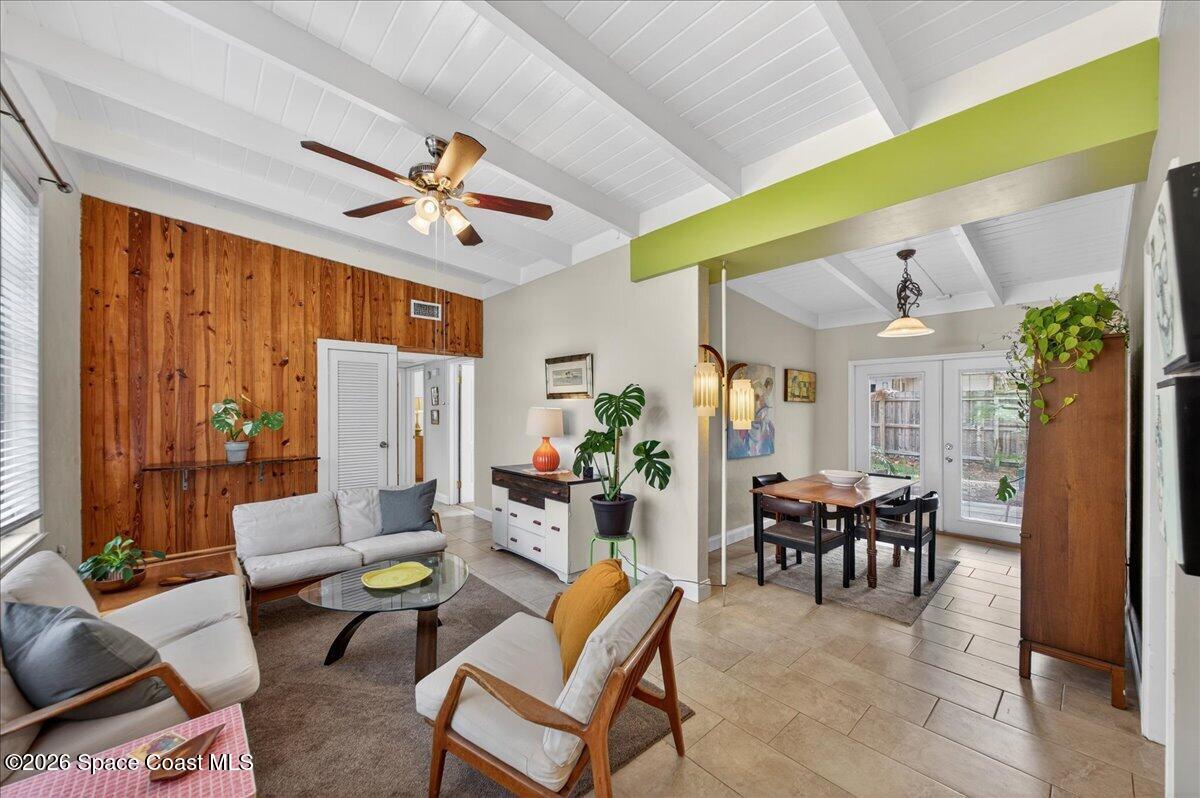 1615 Grandview Way Melbourne, FL 32935 - Photo 7 of 34 a living room with furniture a dining table and a piano
