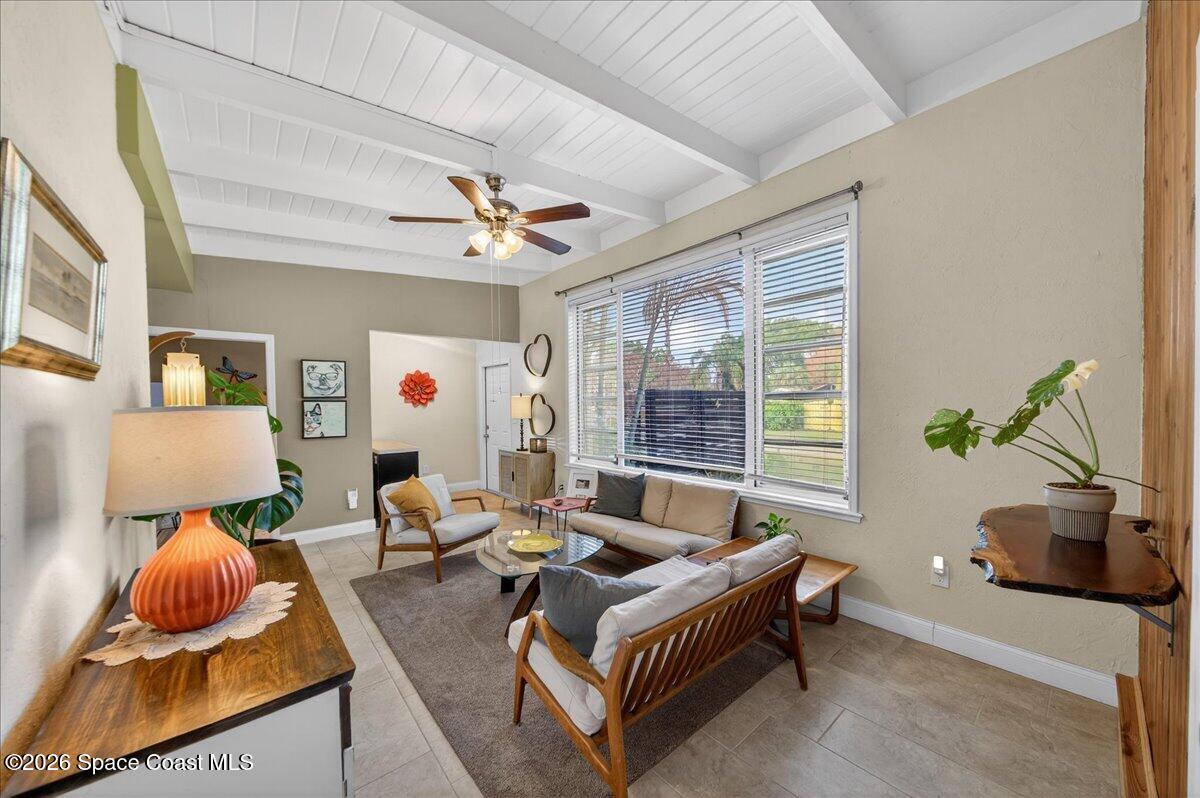 1615 Grandview Way Melbourne, FL 32935 - Photo 8 of 34 a living room with furniture and a large window