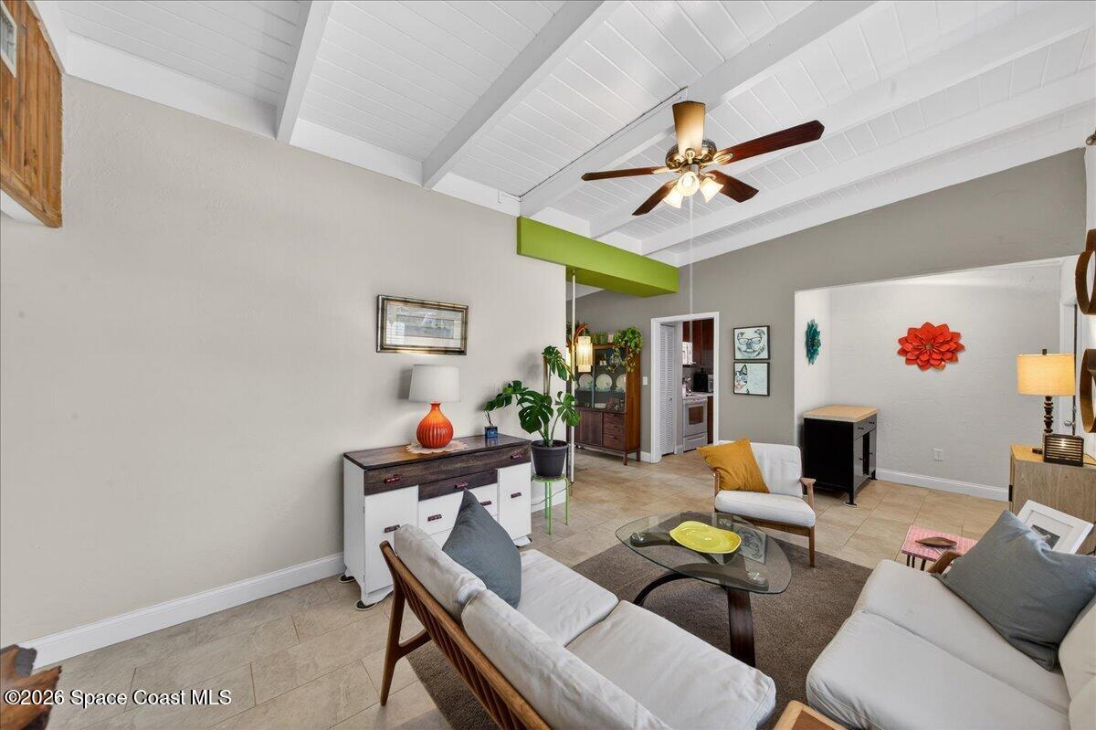 1615 Grandview Way Melbourne, FL 32935 - Photo 9 of 34 a living room with furniture and a flat screen tv