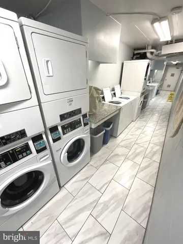 a stove top oven sitting inside of a kitchen