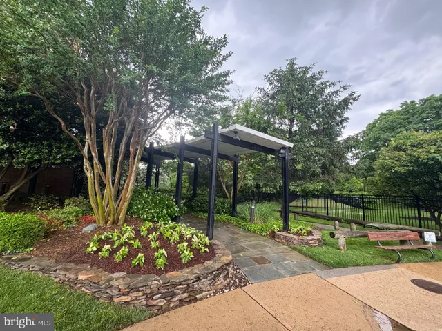 a view of a patio with table and chairs with wooden fence and floor