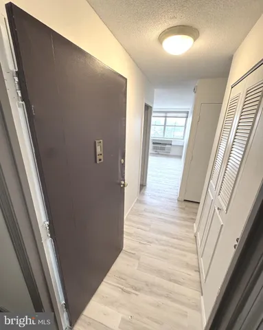 a view of a room with wooden floor
