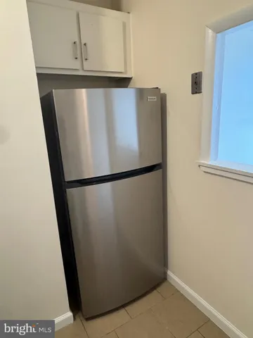 a bathroom with a toilet and a bathtub