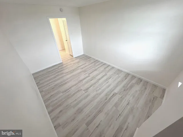 a kitchen with granite countertop white cabinets and a stove