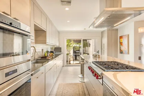a large kitchen with lots of counter space and appliances