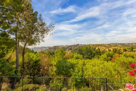a spacious bathroom with a bathtub shower sink double and mirror