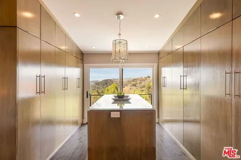 a bedroom with a large bed and a large window