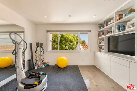 a view of a swimming pool with lawn chairs