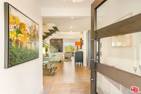 a view of a living room and kitchen
