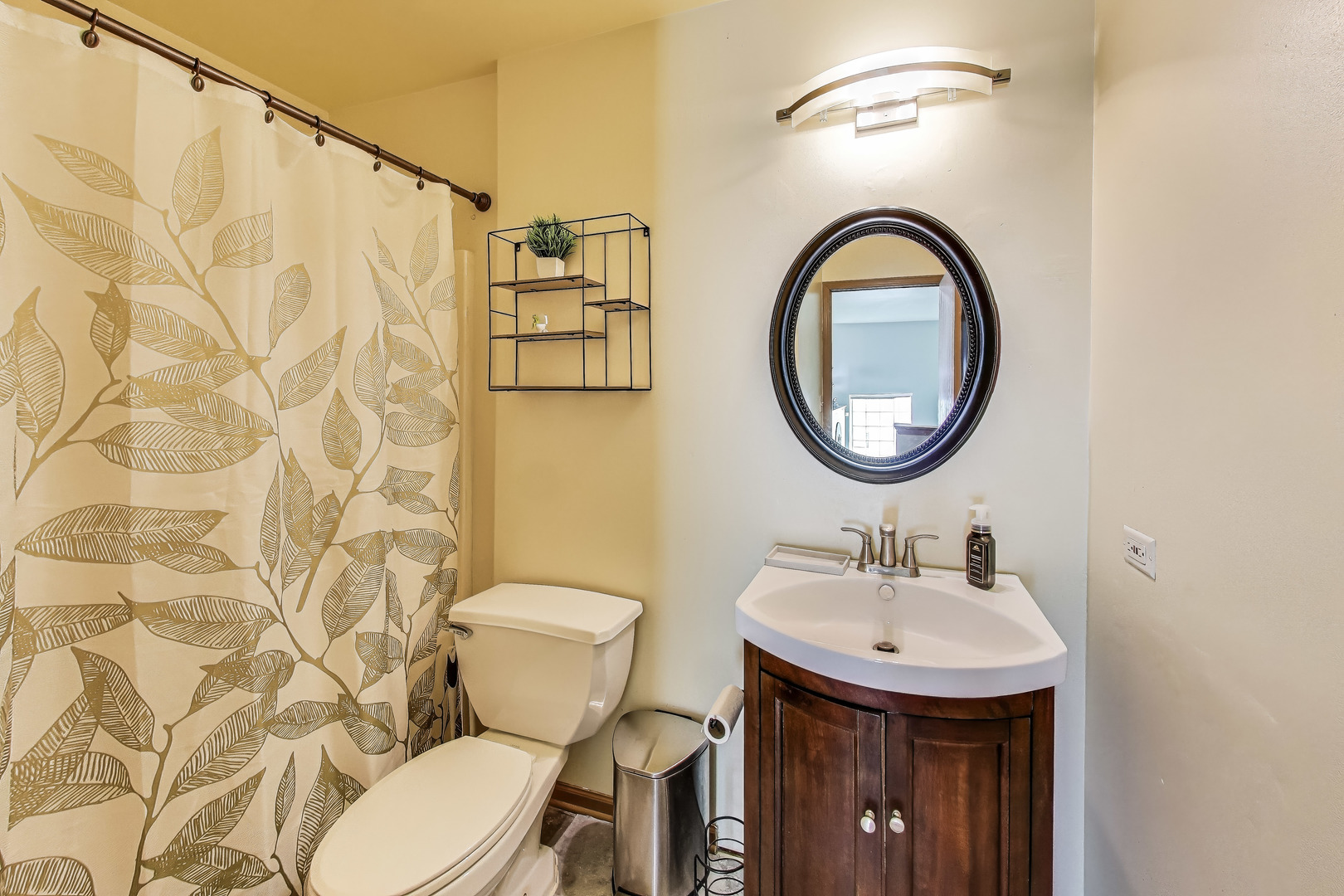 1086 Lily Field Lane Bolingbrook, IL 60440 - Photo 16 of 24 a bathroom with a sink a toilet and a mirror