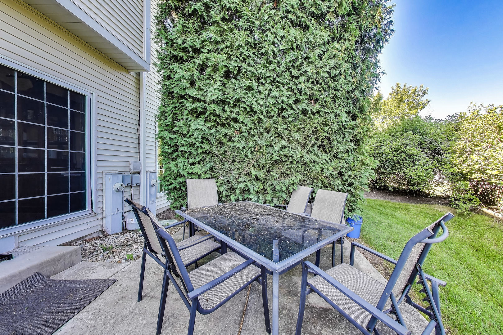 1086 Lily Field Lane Bolingbrook, IL 60440 - Photo 21 of 24 a view of a backyard with table and chairs